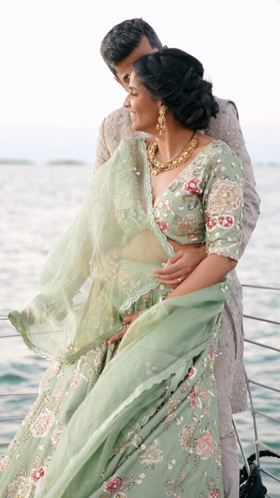 Indian Couple on their wedding day captured by a cultural wedding videographer.  The couple are on a boat for sunset in Key Largo, FL